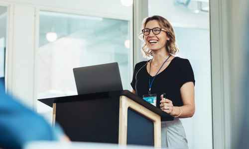 Manager presenting confidently in a workplace environment