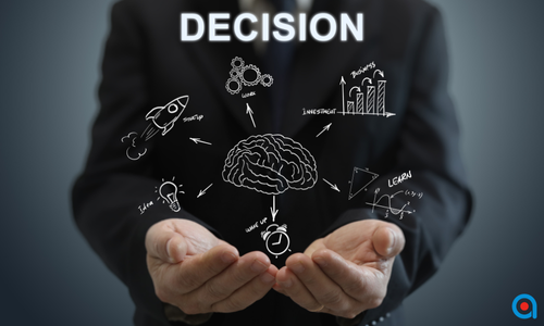 Businessperson holding illustrated decision icons with the word 'DECISION' above.