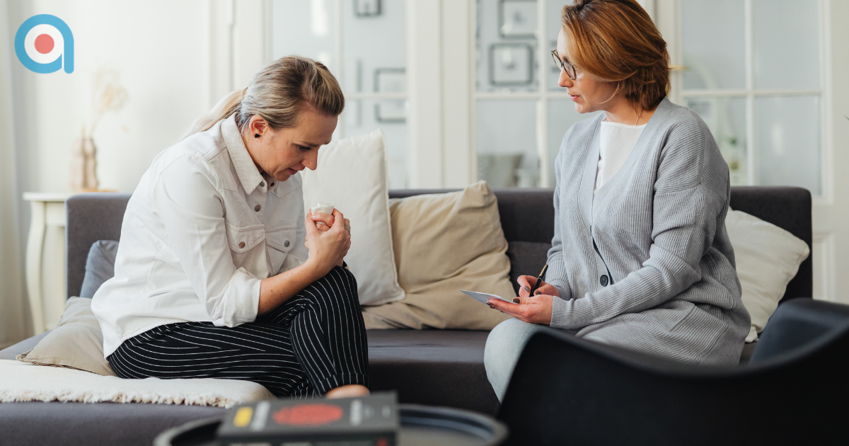 Woman speaking with a coach during a supportive session, representing guidance and confidence building for military partners navigating uncertain times.