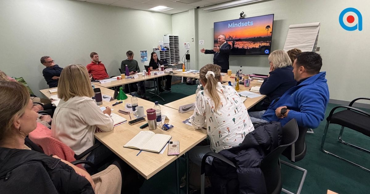 Confident trainer delivering an engaging workplace training session.