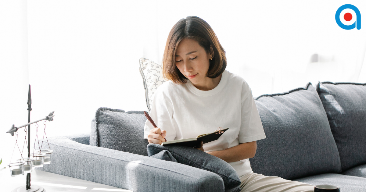 A lady reflecting on her work