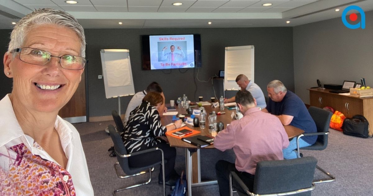 Trainer introducing a Train the Trainer course session.