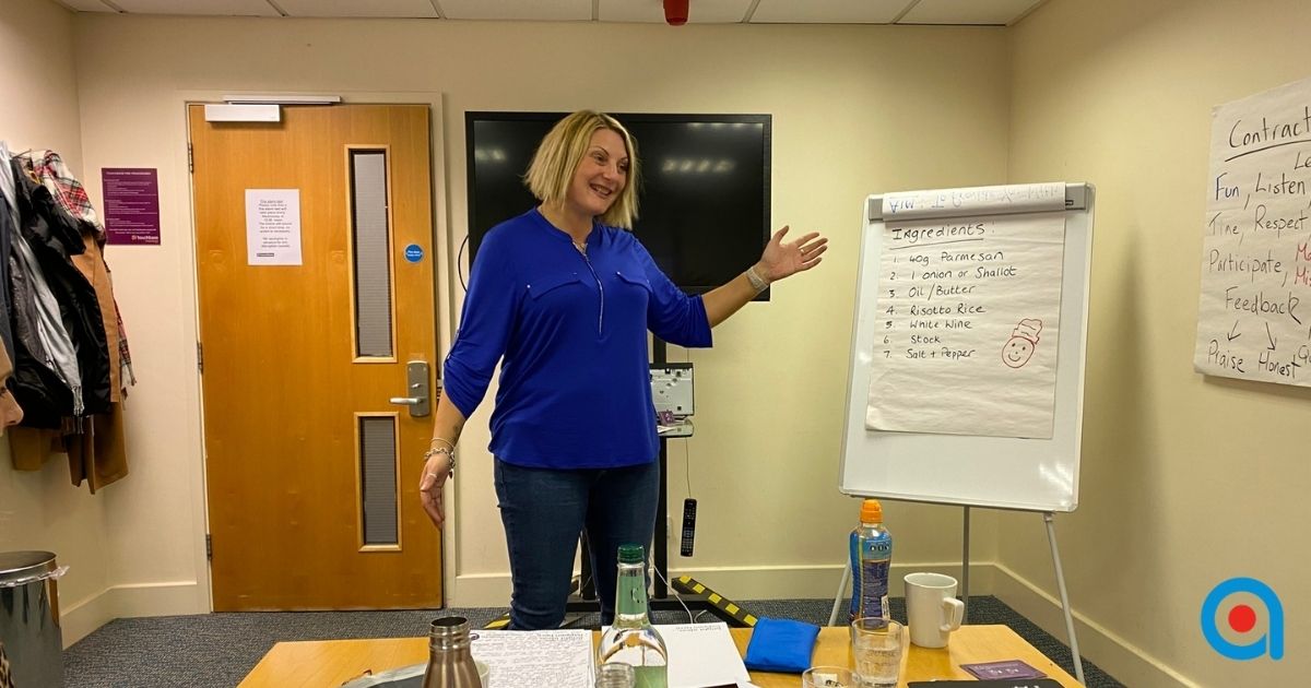 Beginner trainer delivering a training session in a supportive environment.