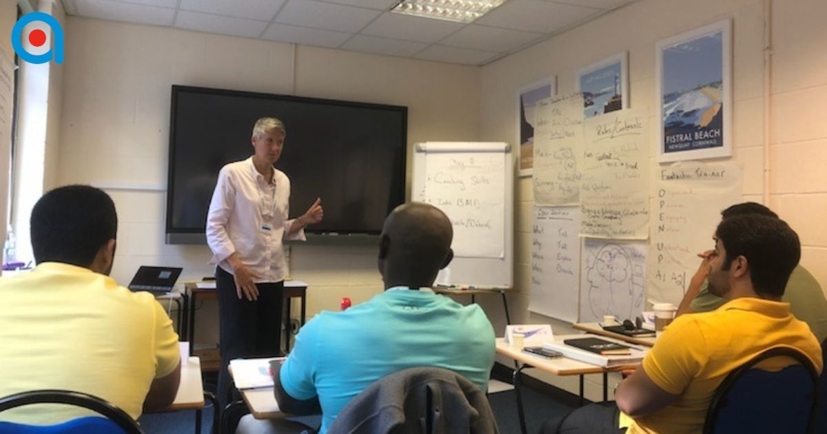 Trainer creating a supportive environment during a Train the Trainer course.